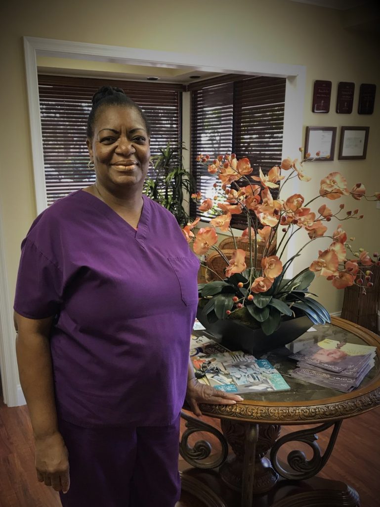Black woman purple nurse clothing